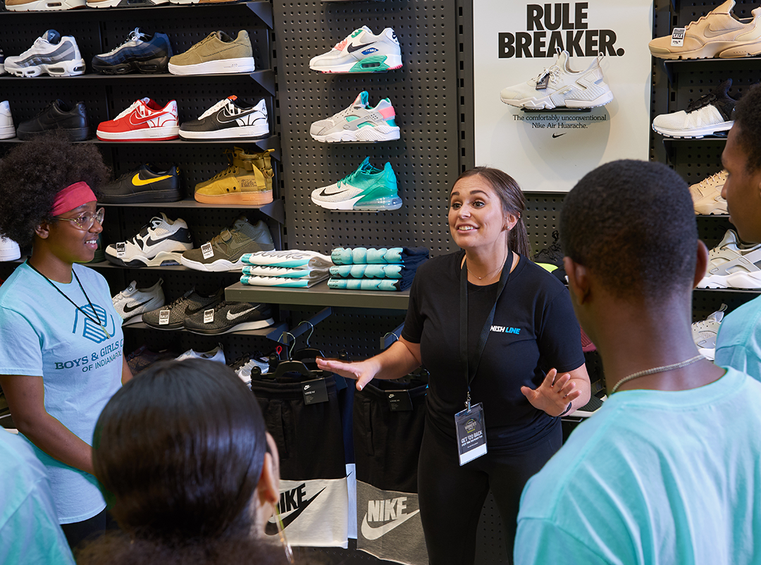 A Finish Line salesperson explaining something